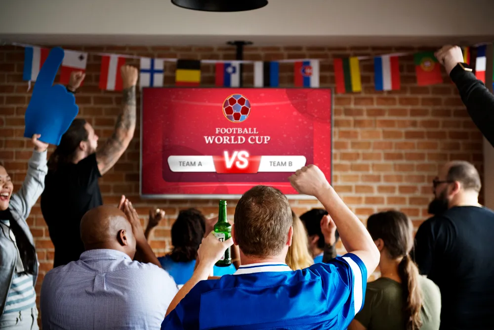 Champions League-match streamad via IPTV på stor-TV med EPG och matchschema synligt